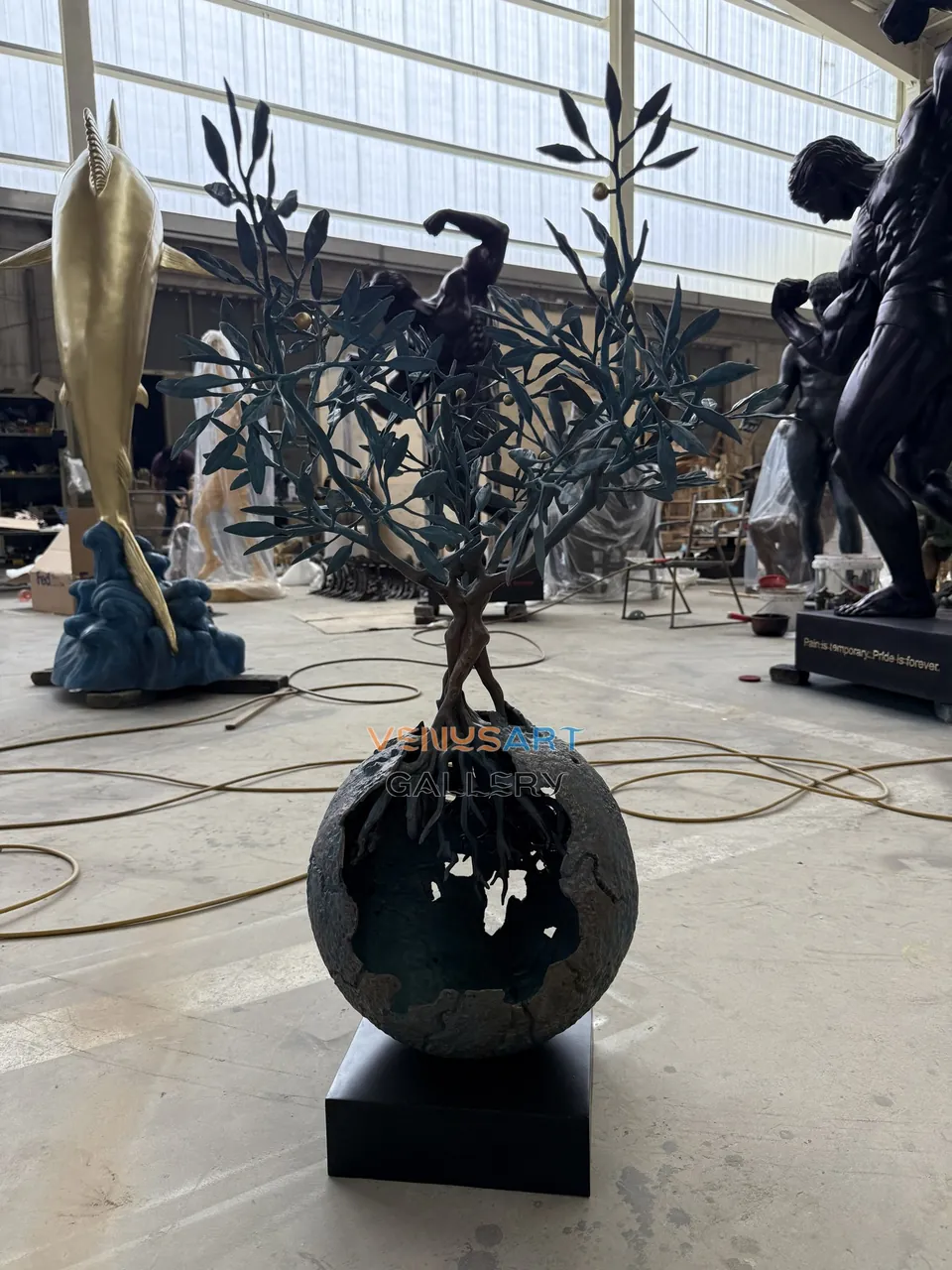 Olive Tree and Hollow Globe Sculpture — product photograph