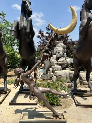 Girl on a Moon Swing Sculpture