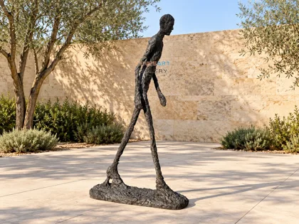 Slender Walking Figure Sculpture
